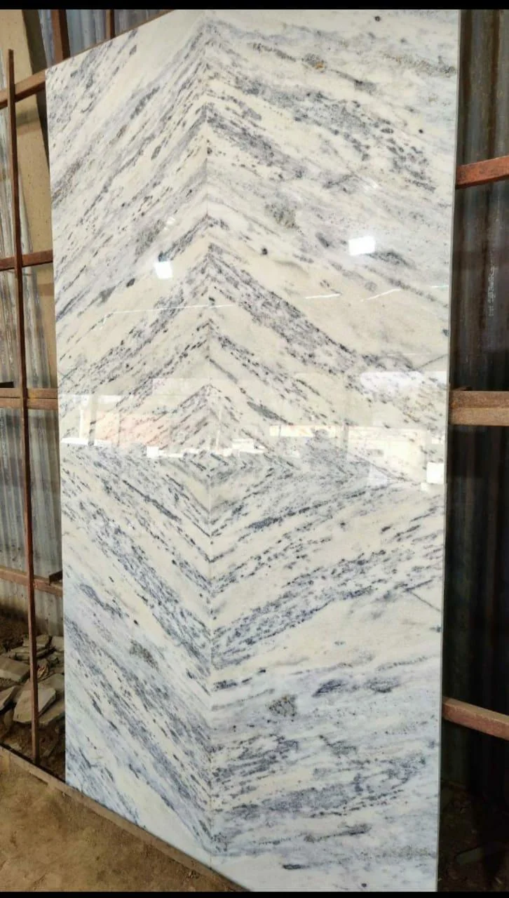 A bookmatched pair of polished marble slabs on the finishing line