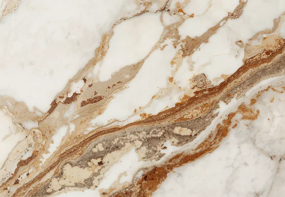 Close view of brown and rust coloured veining in Ambaji White Brown Shade marble