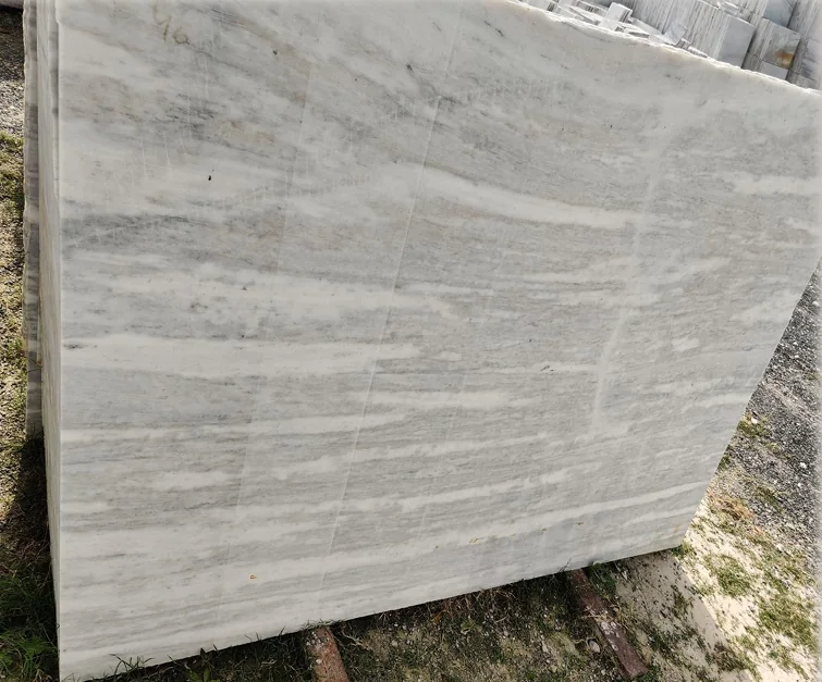 Ambaji White Brown Shade slab in the yard before finishing